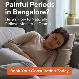 Woman experiencing period cramps while resting at home in Bangalore